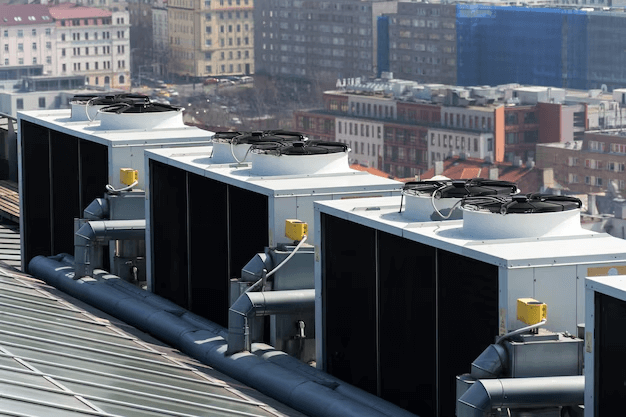 Rooftop commercial HVAC condenser units installed on a building.
