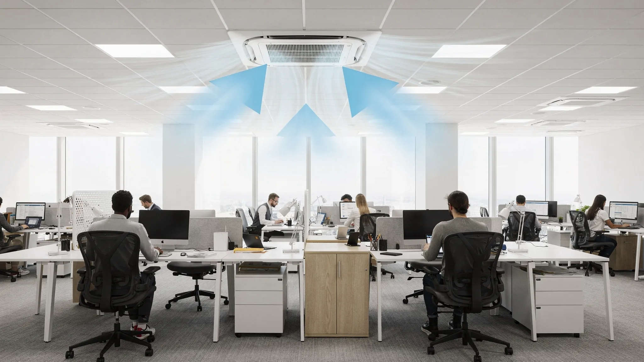 A modern commercial office interior with a ceiling-mounted cassette air conditioner centered in a false ceiling grid, showing four-way airflow arrows and evenly cooled seating areas below.
